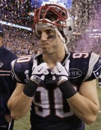 New England Patriots linebacker Niko Koutouvides walks off the field after the Patriots' 21-17 loss to the New York Giants in the NFL Super Bowl XLVI football game, Sunday, Feb. 5, 2012, in Indianapolis.