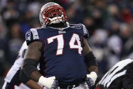 Kyle Love #74 of the New England Patriots celebrates after a sack against the Denver Broncos during their AFC Divisional Playoff Game at Gillette Stadium on January 14, 2012 in Foxboro, Massachusetts.