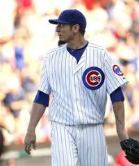 Chicago Cubs starting pitcher Matt Garza looks at the scoreboard after pitching out of a jam in the seventh inning against the St Louis Cardinals in a baseball game on Saturday Aug. 20, 2011 in Chicago.