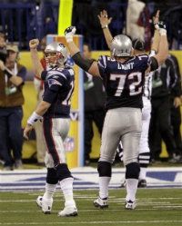 New England Patriots quarterback Tom Brady celebrates with Matt Light (72) after throwing a 12-yard touchdown pass during the second half of the NFL Super Bowl XLVI football game against the New York Giants, Sunday, Feb. 5, 2012, in Indianapolis.