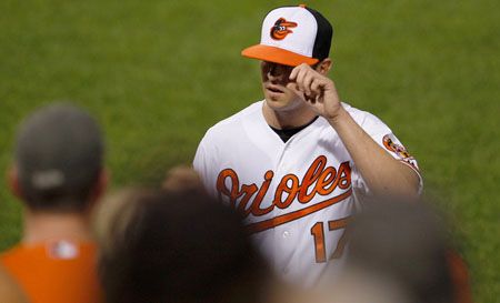 Starting pitcher Brian Matusz #17 of the Baltimore Orioles acknowledges the crowd after being pulled during the seventh inning of the Orioles 4-1 win over the Boston Red Sox at Oriole Park at Camden Yards on May 22, 2012 in Baltimore, Maryland.