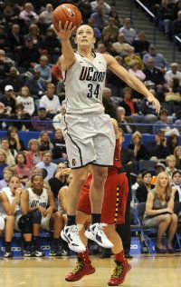UConn's Kelly Faris scoops in a layup in the second half Monday. 