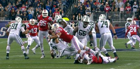 New England Patriots defensive end Rob Ninkovich (50) sacks New York Jets quarterback Mark Sanchez (6) to clinch a 29-26 Patriots win in overtime of an NFL football game in Foxborough, Mass., Sunday, Oct. 21, 2012.