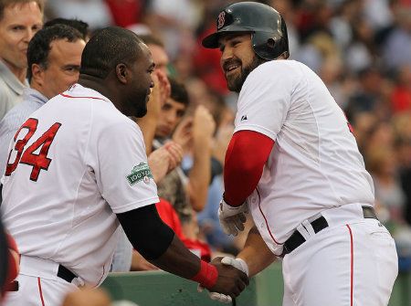 Kelly Shoppach #10 of the Boston Red Sox celebrates his home run with teammate David Ortiz #34 of the Boston Red Sox in the second inning against the Miami Marlins during interleague play at Fenway Park June 19, 2012 in Boston, Massachusetts