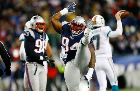 Justin Francis #94 of the New England Patriots celebrates a sack against Ryan Tannehill #17 of the Miami Dolphins in the second half during the game at Gillette Stadium on December 30, 2012 in Foxboro, Massachusetts.