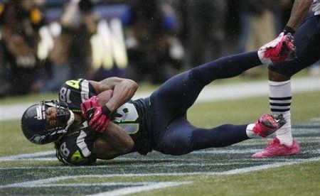 Seattle Seahawks' Sidney Rice comes down with a game-winning touchdown reception in the second half of an NFL football game against the New England Patriots, Sunday, Oct. 14, 2012, in Seattle. 