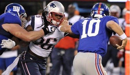 New England Patriots linebacker Jermaine Cunningham (96)  sacks quarterback Eli Manning (10) during the first half of a preseason NFL football game, Wednesday, Aug. 29, 2012, in East Rutherford, N.J.