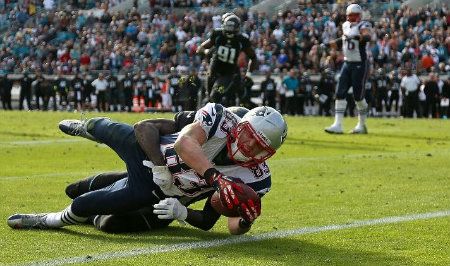 Wes Welker #83 of the New England Patriots dives for a touchdown during a game against the Jacksonville Jaguars at EverBank Field on December 23, 2012 in Jacksonville, Florida.