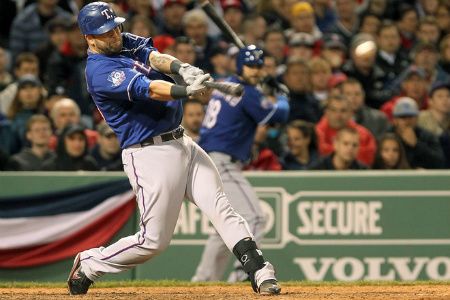 Mike Napoli #25 of the Texas Rangers connects for a two-run double in the 8th inning against the Boston Red Sox at Fenway Park April 18, 2012 in Boston, Massachusetts. 