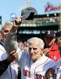 Former Boston Red Sox Johnny Pesky greets the fans before the home opener between the Boston Red Sox and the Tampa Bay Rays on April 13, 2012 at Fenway Park in Boston, Massachusetts.
