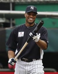 Robinson Cano of the New York Yankees checks his bat during a batting practice for the Taiwan All Star Series in Xinzhuang, Taiwan, Monday, Oct. 31, 2011.