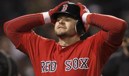 Cody Ross #7 of the Boston Red Sox reacts to lining into a double play against the Baltimore Orioles during the eighth inning of the game at Fenway Park on May 4, 2012 in Boston, Massachusetts.