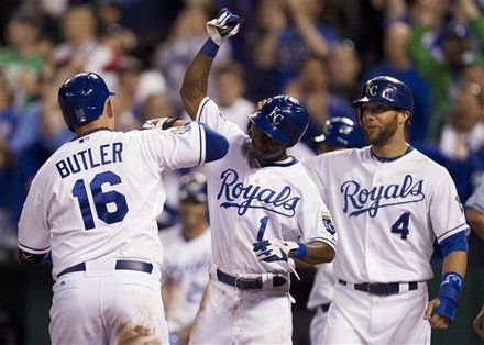 Kansas City Royals' Billy Butler (16) is congratulated by teammates Jarrod Dyson (1) and Alex Gordon (4) after his three-run home run in the eighth inning of a baseball game in Kansas City, Mo., Tuesday, May 8, 2012