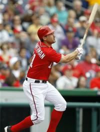Washington Nationals' Ryan Zimmerman doubles to right field during the first inning of a baseball game against the Florida Marlins, Sunday, Sept. 18, 2011, in Washington.