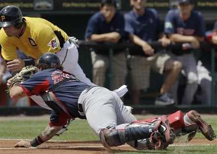 Boston Red Sox catcher Jarrod Saltalamacchia tags out Pittsburgh Pirates' Matt Hague at the plate after Pirates pitcher Kevin Correia hit into a second-inning fielders choice during their spring training baseball game at McKechnie Field in Bradenton, Fla., Wednesday, March 21, 2012.
