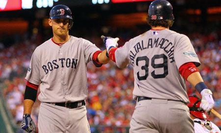 Will Middlebrooks #64 of the Boston Red Sox is congratulated by teammate Jarrod Saltalamacchia #39 after Middlebrooks home run in the fourth inning against the Philadelphia Phillies in a MLB baseball game on May 19, 2012 at Citizens Bank Park in Philadelphia, Pennsylvania.