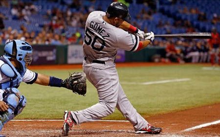 Infielder Mauro Gomez #50 of the Boston Red Sox singles in a pair of runs against the Tampa Bay Rays during the game at Tropicana Field on September 17, 2012 in St. Petersburg, Florida.
