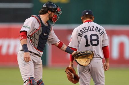 Jarrod Saltalamacchia #39 of the Boston Red Sox talks to Daisuke Matsuzaka #18 of the Boston Red Sox in the second inning of their game against the Oakland Athletics at O.co Coliseum on July 2, 2012 in Oakland, California.