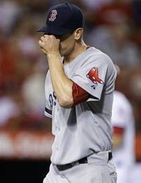 Boston Red Sox starting pitcher Zach Stewart leaves the game against the Los Angeles Angels after the third inning of an baseball in Anaheim, Calif., Wednesday, Aug. 29, 2012. 