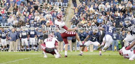 Brandon McManus kicks the winning field goal in OT against UConn as Temple goes on to a 17-14 victory on Homecoming day at Rentschler Field in East Hartford Saturday. 