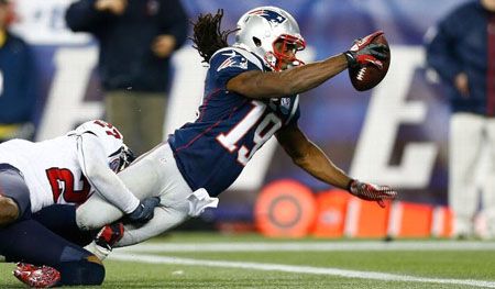 Donte' Stallworth #19 of the New England Patriots dives across the goal line to score a touchdown in the third quarter against the Houston Texans during the game at Gillette Stadium on December 10, 2012 in Foxboro, Massachusetts.