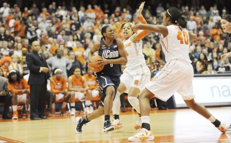 Huskies guard Tiffany Hayes drives against Syracuse Orange forward Iasia Hemingway (43) and center Kayla Alexander (40)during the first half of the game at the Carrier Dome. 