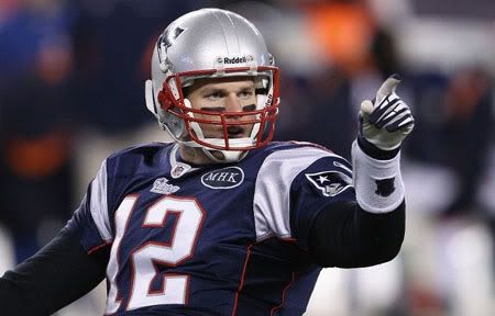 Tom Brady #12 of the New England Patriots reacts after he threw a 19-yard touchdown pass to Rob Gronkowski #87 in the second quarter against the Denver Broncos during their AFC Divisional Playoff Game at Gillette Stadium on January 14, 2012 in Foxboro, Massachusetts.