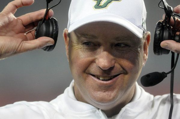  University of South Florida coach Skip Holtz is all smiles after his team beat UConn, 13-6, at Raymond James Stadium Saturday night. 