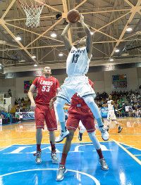  UConn guard Shabazz Napier breaks to the basket against New Mexico's Alex Kirk during first half action at the Paradise Jam final. 