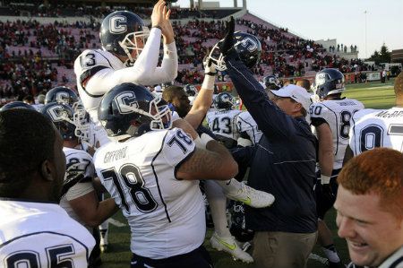 Chad Christen is carried off the field after his field goal in the third overtime gave UConn a 23-20 victory over Louisville at Papa John's Stadium. 