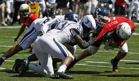 Connecticut Huskies linebacker Sio Moore (3) sacks Maryland Terrapins quarterback Perry Hills (11) at Byrd Stadium.