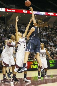 UConn center Stefanie Dolson takes a shot over Texas A&M forward Kristi Bellock (5) during the first half at the Reed Arena. 
