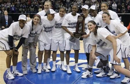 Connecticut team member pose with the regional trophy after Connecticut defeated Kentucky in an NCAA women's college basketball tournament regional final in Kingston, R.I., Tuesday, March 27, 2012.