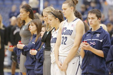  The Connecticut Huskies pay tribute to those who were killed at the Sandy Hook Elementary School in Newtown Connecticut this past Friday before the start of the game against the Oakland Golden Grizzlies at the XL Center. 