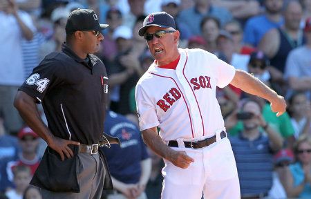 Bobby Valentine #25 of the Boston Red Sox argues with umpire Al Porter after Valentine was ejected from the game in the ninth inning against the Washington Nationals during interleague play at Fenway Park June 10, 2012 in Boston, Massachusetts