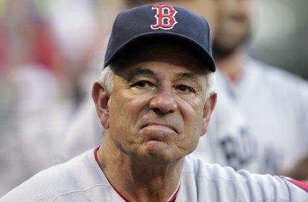 Boston Red Sox manager Bobby Valentine (25) looks out from the dugout during the first inning of a baseball game against the Texas Rangers, Monday, July 23, 2012, in Arlington, Texas.