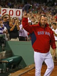 Boston Red Sox starting pitcher Tim Wakefield acknowledges the crowd after recording his 200th career win against the Toronto Blue Jays in their MLB American League baseball game at Fenway Park in Boston, Massachusetts September 13, 2011.