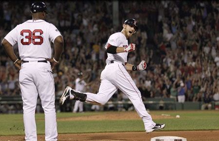 Will Middlebrooks #64 of the Boston Red Sox shouts out while rounding the bases after his two-run home run against the Miami Marlins during the eighth inning of the game at Fenway Park on June 21, 2012 in Boston, Massachusetts.