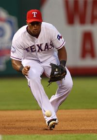 Adrian Beltre #29 of the Texas Rangers field a ground ball and throws to first base for the out against the Oakland Athletics at Rangers Ballpark in Arlington on September 24, 2012 in Arlington, Texas. 