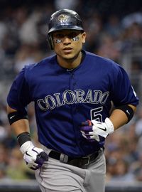 Carlos Gonzalez #5 of the Colorado Rockies hits a homerun against the San Diego Padres during an MLB game on July 20, 2012 in San Diego, California. Players of the Colorodo Rockies are wearing 7-20 eye black stickers in mourning over the Aurora, Colorado shootings. 