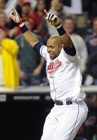 Carlos Santana #41 of the Cleveland Indians celebrates after hitting a walk-off solo home run in the ninth inning to defeat the Minnesota Twins 6-5 at Progressive Field on September 23, 2011 in Cleveland, Ohio. 