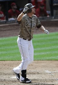 Chase Headley #7 of the San Diego Padres watches the flight of his grand slam hit during the seventh inning of a baseball game against the Arizona Diamondbacks at Petco Park on September 9, 2012 in San Diego, California. 