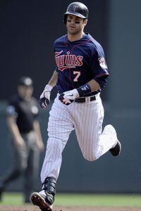 Joe Mauer #7 of the Minnesota Twins rounds the bases after hitting a solo home run against the Chicago White Sox during the first inning on September 16, 2012 at Target Field in Minneapolis, Minnesota. 