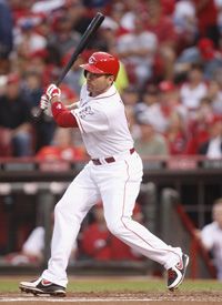 Joey Votto #19 of the Cincinnati Reds singles to center field during the game against the Los Angeles Dodgers at Great American Ball Park on September 21, 2012 in Cincinnati, Ohio.