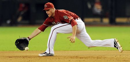 Lyle Overbay #37 of the Arizona Diamondbacks makes a play on a ground ball against the Houston Astros at Chase Field on July 22, 2012 in Phoenix, Arizona. 