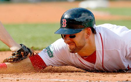  Ryan Kalish #55 of the Boston Red Sox is out when he was caught off of first base against the Toronto Blue Jays at Fenway Park on September 9, 2012 in Boston, Massachusetts. 