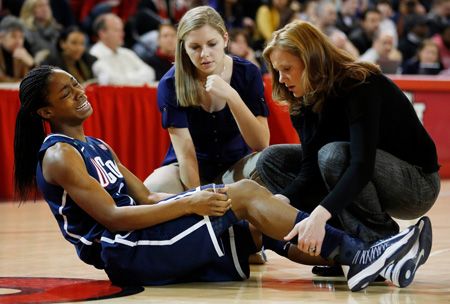 Sophomore guard Brianna Banks winces in pain after injuring her right knee against St. John's 