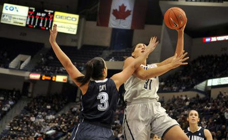 Jesse Carey of Villanova defends against Stefanie Dolson of UConn during the first half of UConn against Villanova.