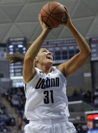 The Connecticut Huskies' Stefanie Dolson scores two of her 22 first-half points at Gampel Pavilion Sunday against DePaul.