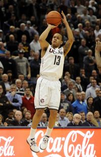  Shabazz Napier hits a three-pointer in overtime to help UConn put away Cincinnati 73-66 in Hartford. 